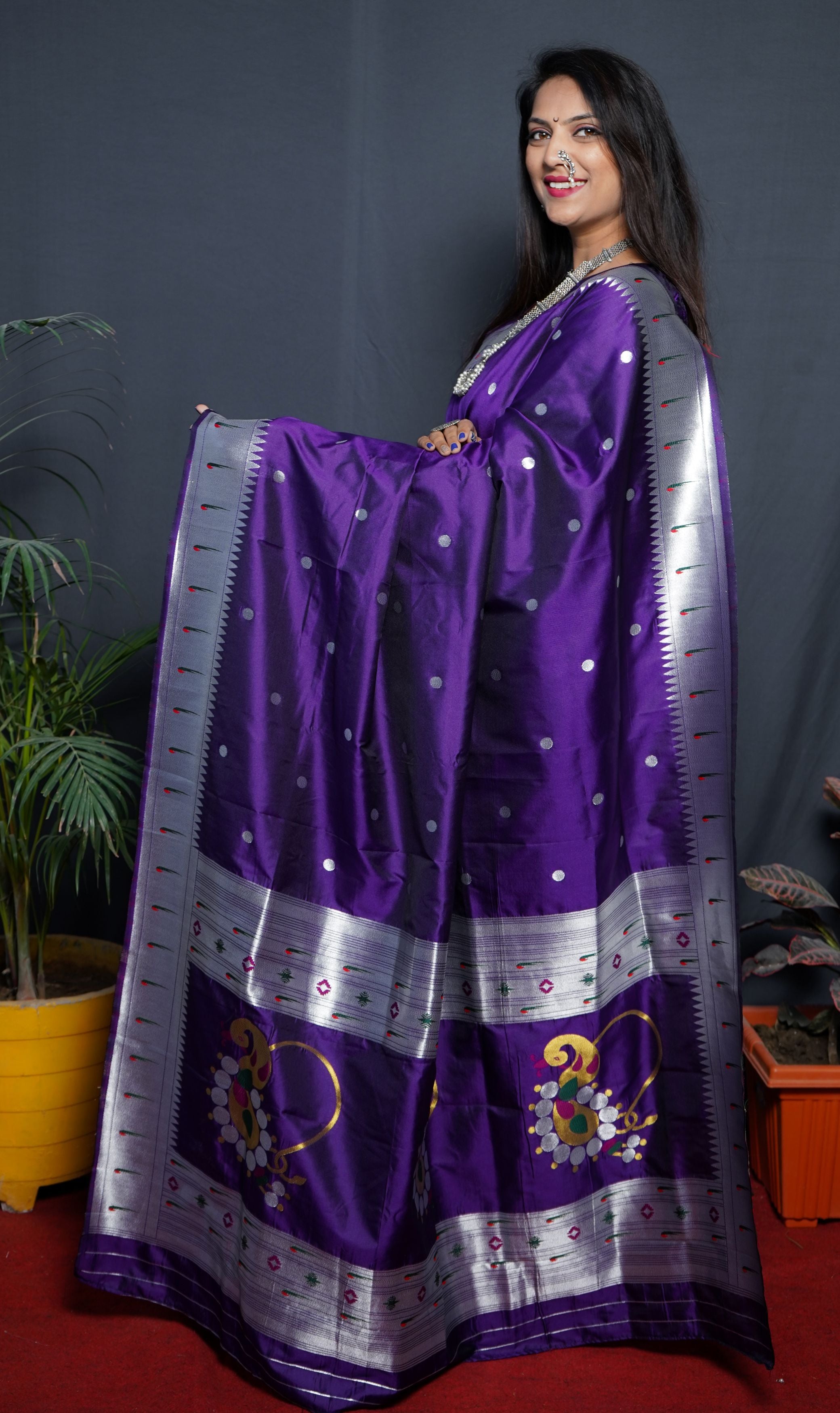 Purple color pure paithani silk saree with muniya bodar and beautiful Silver and meenakari nath pallu and blouse pis