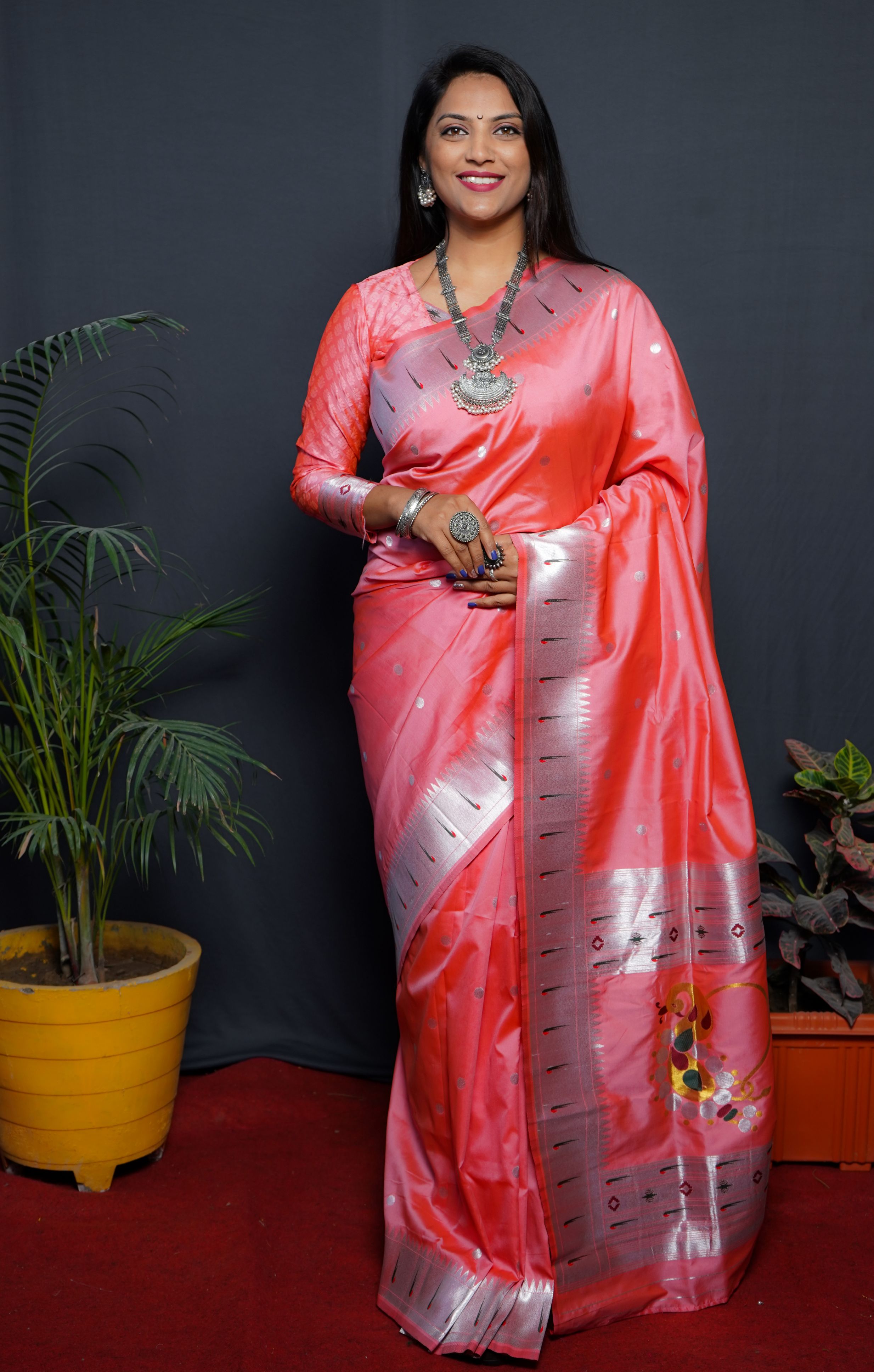Peach color pure paithani silk saree with muniya bodar and beautiful Silver and meenakari nath pallu and blouse pis