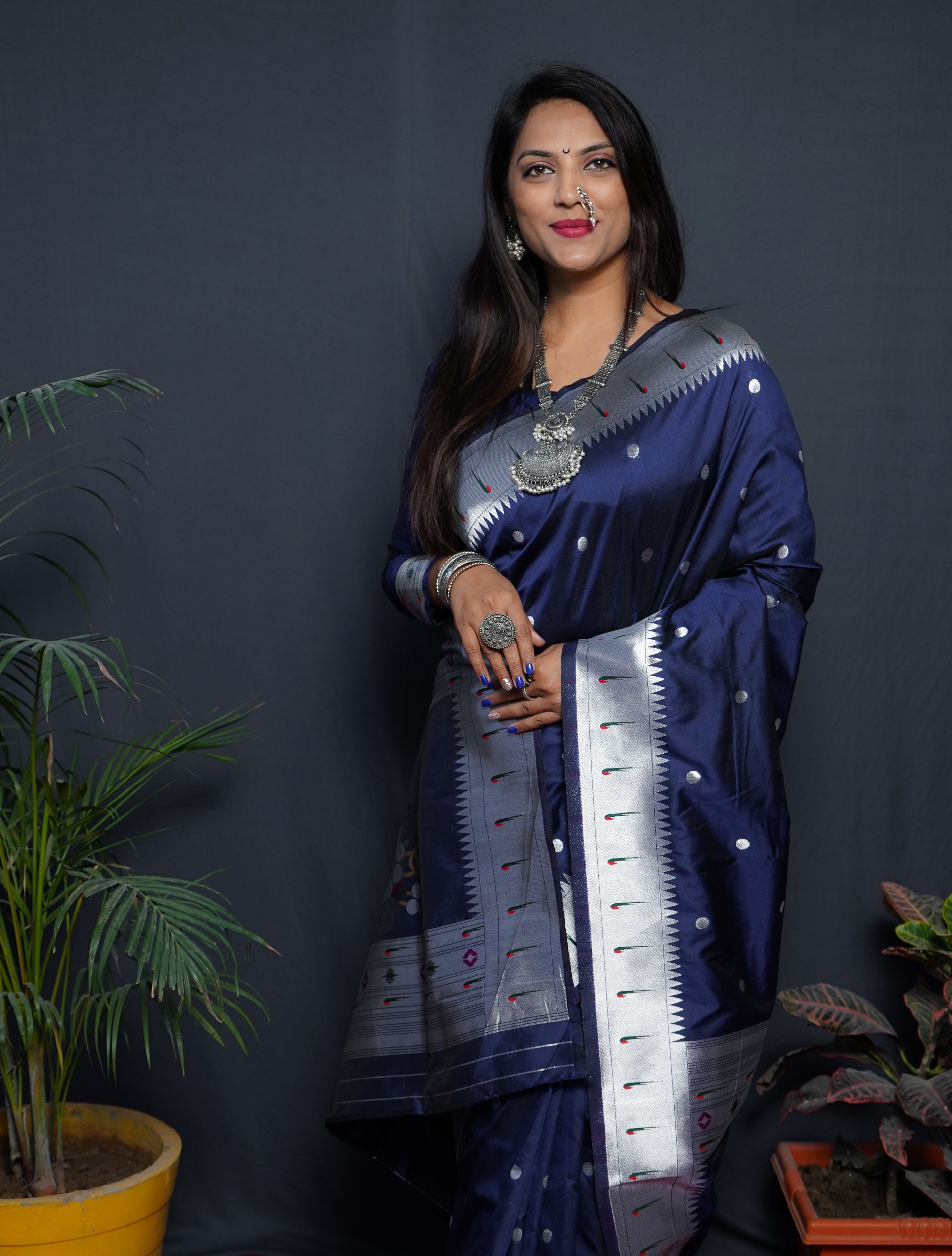 Navy blue color pure paithani silk saree with muniya bodar and beautiful Silver and meenakari nath pallu and blouse pis