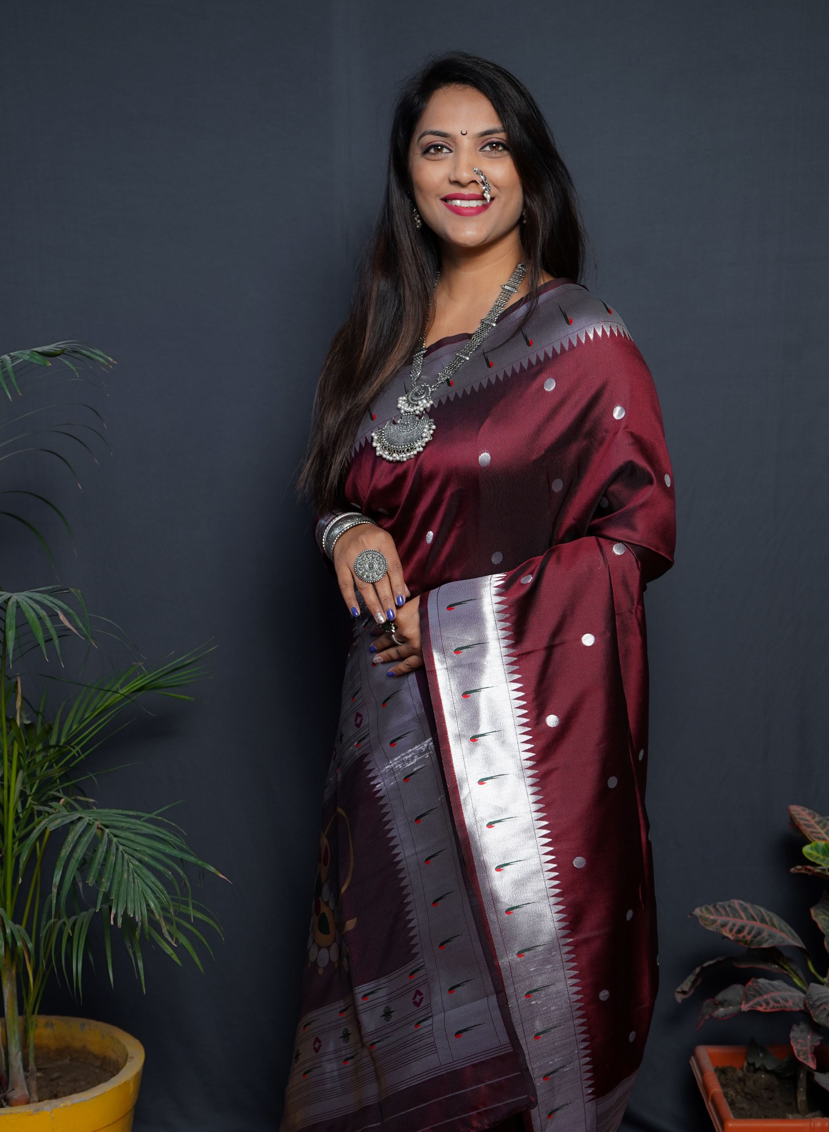 Maroon color pure paithani silk saree with muniya bodar and beautiful Silver and meenakari nath pallu and blouse pis