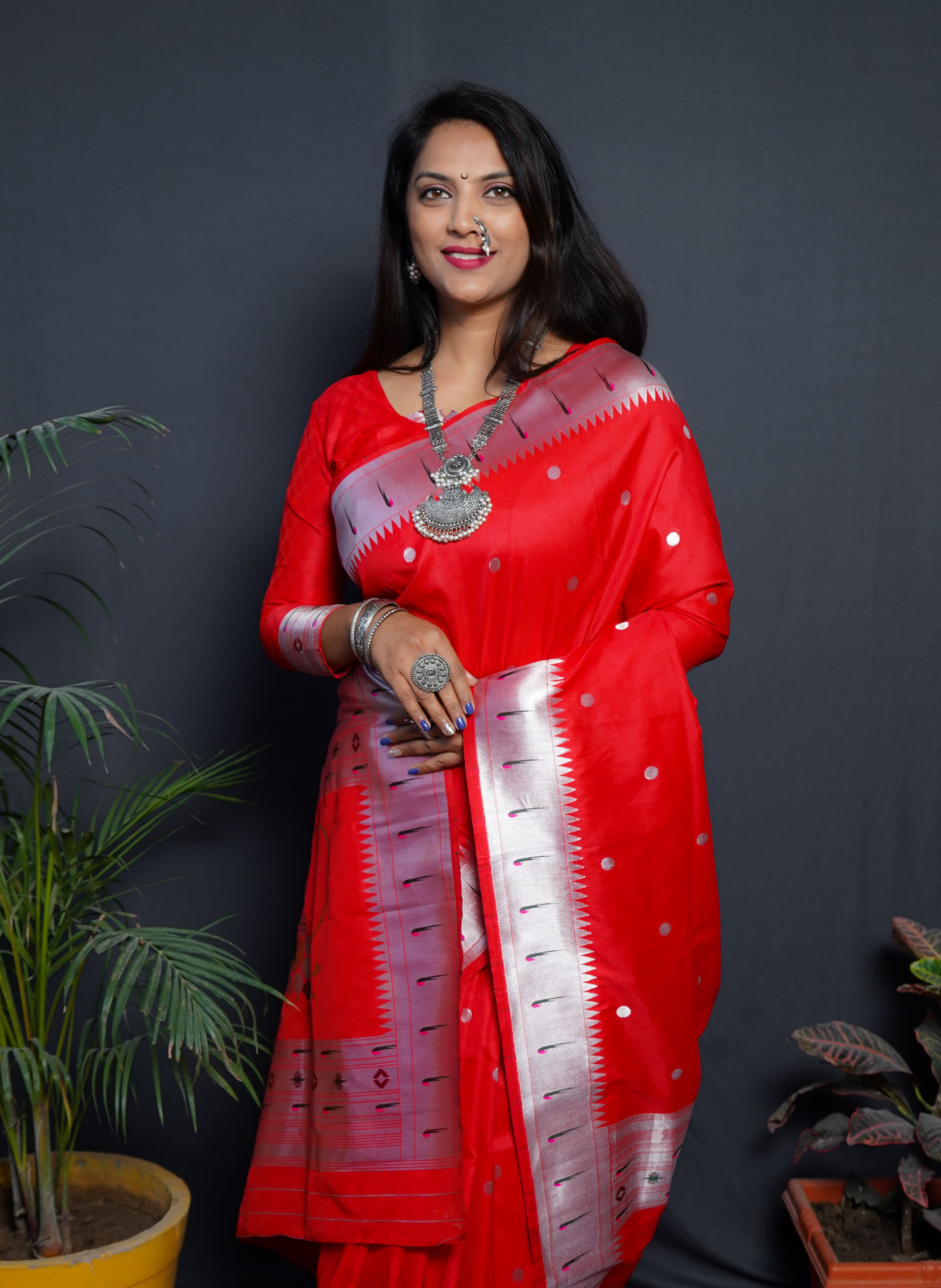 Red color pure paithani silk saree with muniya bodar and beautiful Silver and meenakari nath pallu and blouse pis