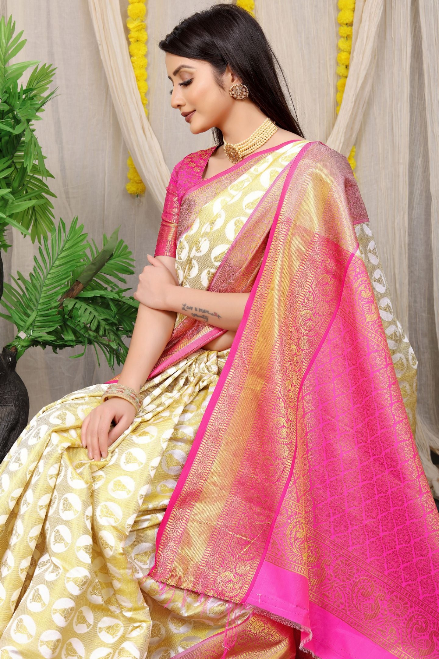 South Indian Woman In White Saree Looking At Flower Decoration On The  Occasion Of Onam High-Res Stock Photo - Getty Images